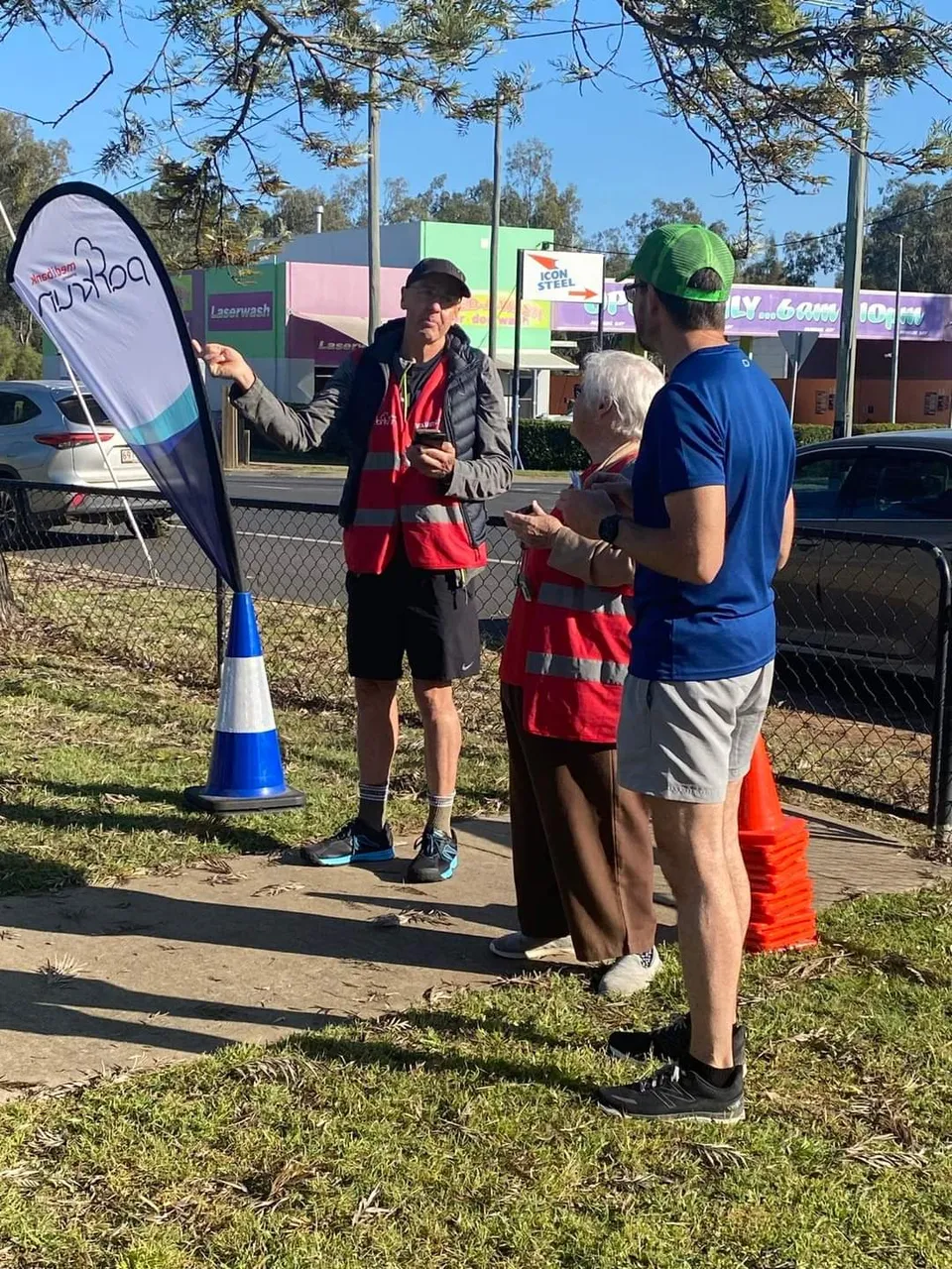 Me telling the event director and finish token volunteer that I could have been first finisher if not for my ankle. Everyone is a winner at parkrun but there is still only one first finisher LOL