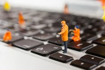 miniature-workmen-repairing-a-laptop-keyboard_1252-852.jpg