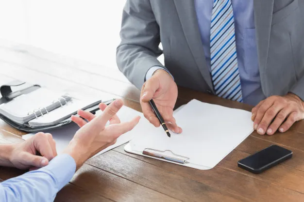 businessman-explaining-contract-co-worker_13339-251856.jpg