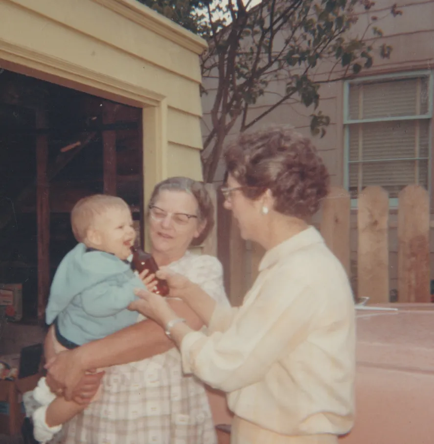 1964-09 - Ann with a woman and a baby boy.png
