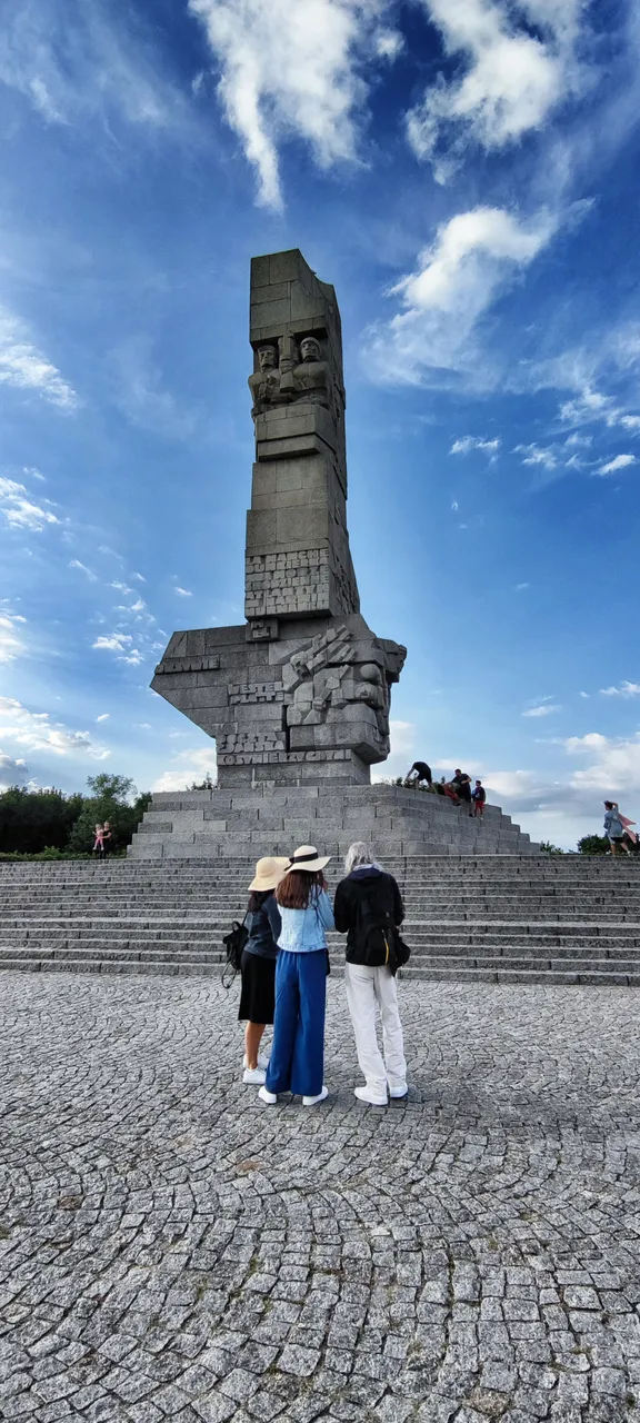 Polish people before the monument