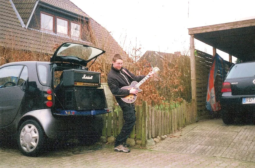 Marius playing dad's guitar