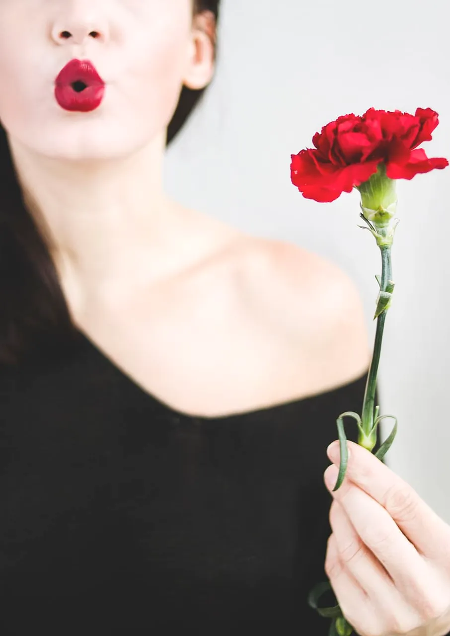 woman-blowing-kiss-flower-red.jpg