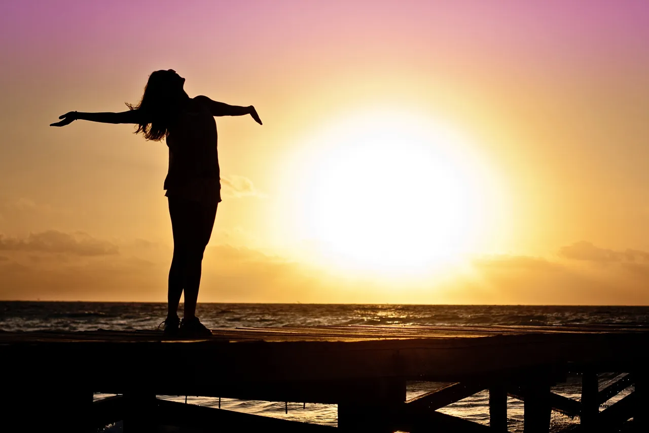 dawn-sunset-beach-woman-39853.jpg