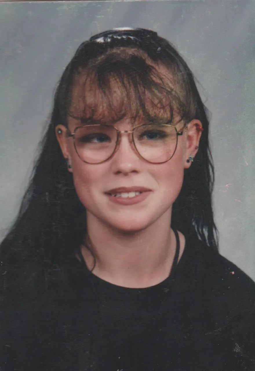 1996-10 - Katie Arnold in black shirt, black hair, not sure what year or month, front side.png