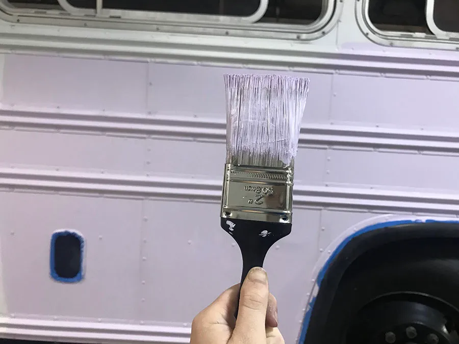 purple-paint-brush-exterior-skoolie.jpg