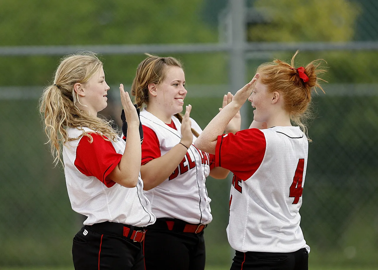 softball-girls-team-mates-happy-163465.jpeg