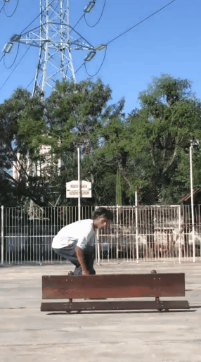 kick flip over bench.gif