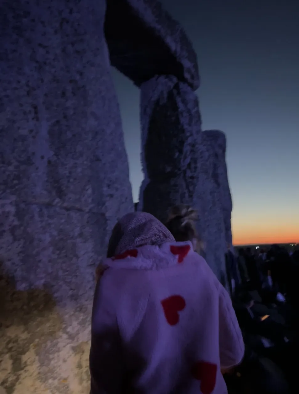 Housewife made a quick run to make it in time for the ceremony, Summer Solstice, Stonehenge, UK, 2024