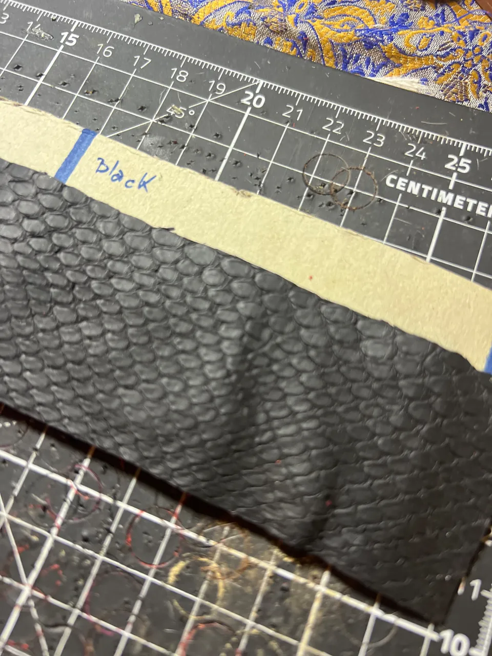 Black: The First Layer of Leather been cut according to the pattern: The Leather is Snake Skin :)
