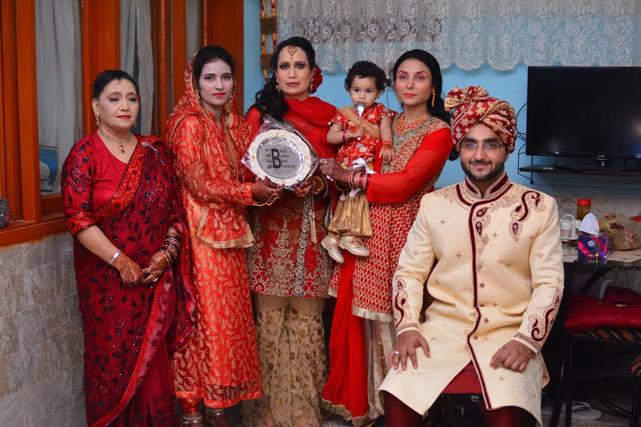Picture from the wedding while recieving the award from my mother-in-law