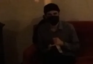 poet reading from phone