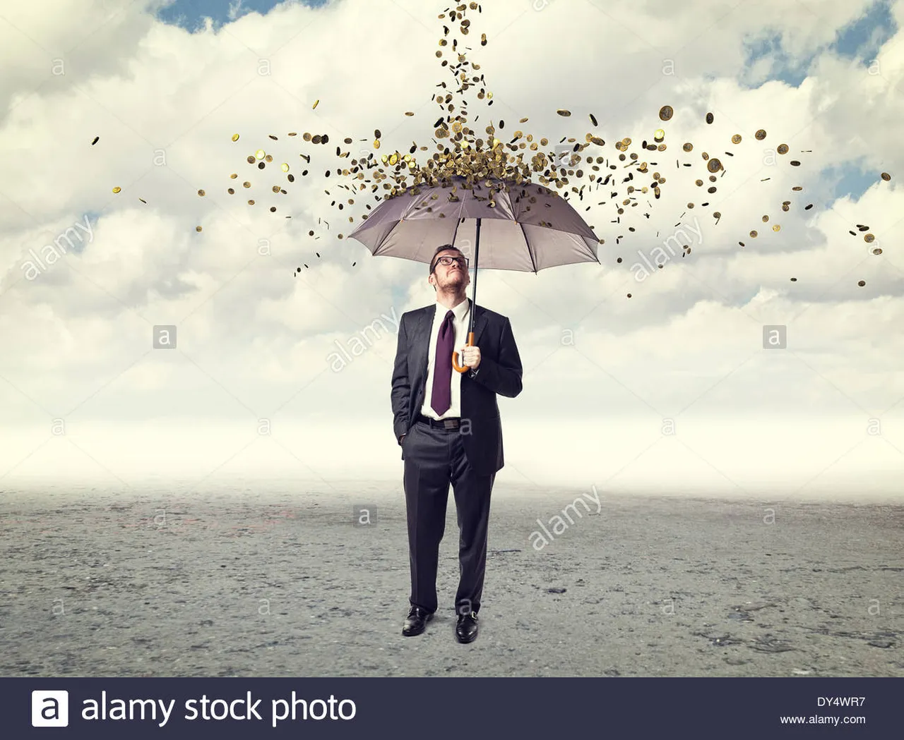 man-with-umbrella-and-coin-rain-DY4WR7.jpg