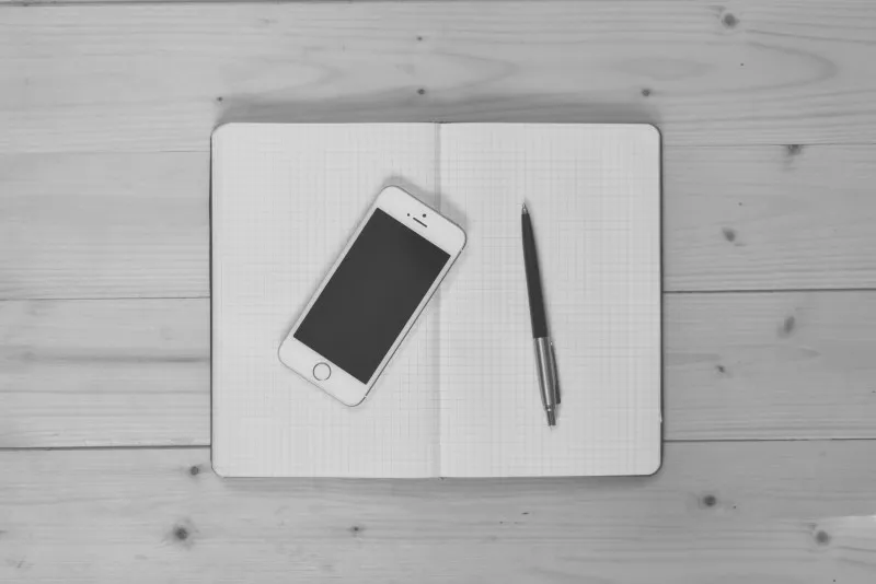 aerial-view-of-notebook-ballpoint-and-mobile-phone.jpg