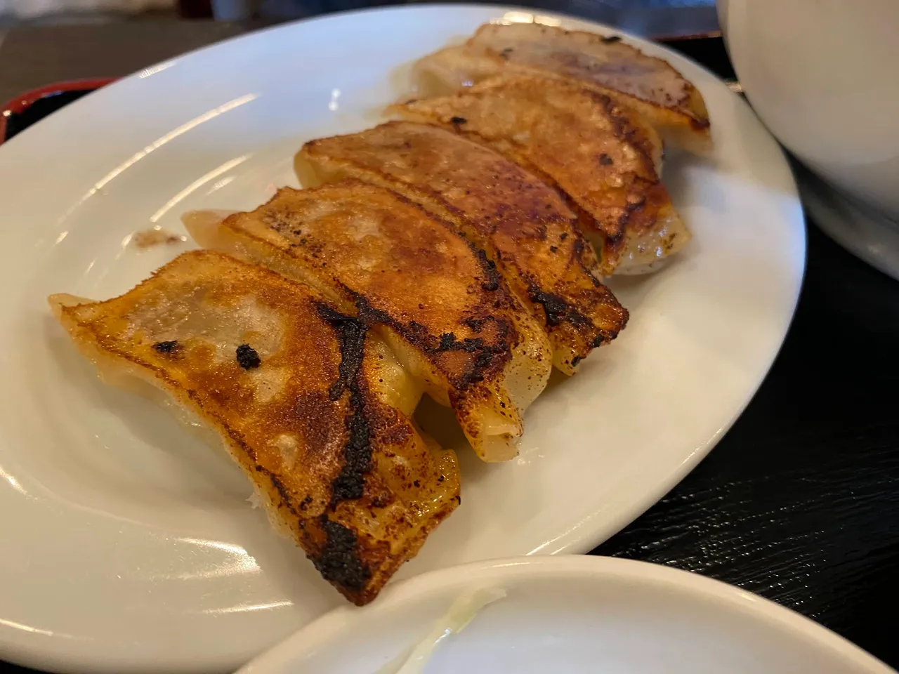 Gyoza arrived late but still delicious