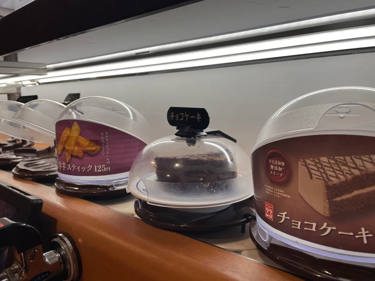 Chocolate cake in the conveyor belt