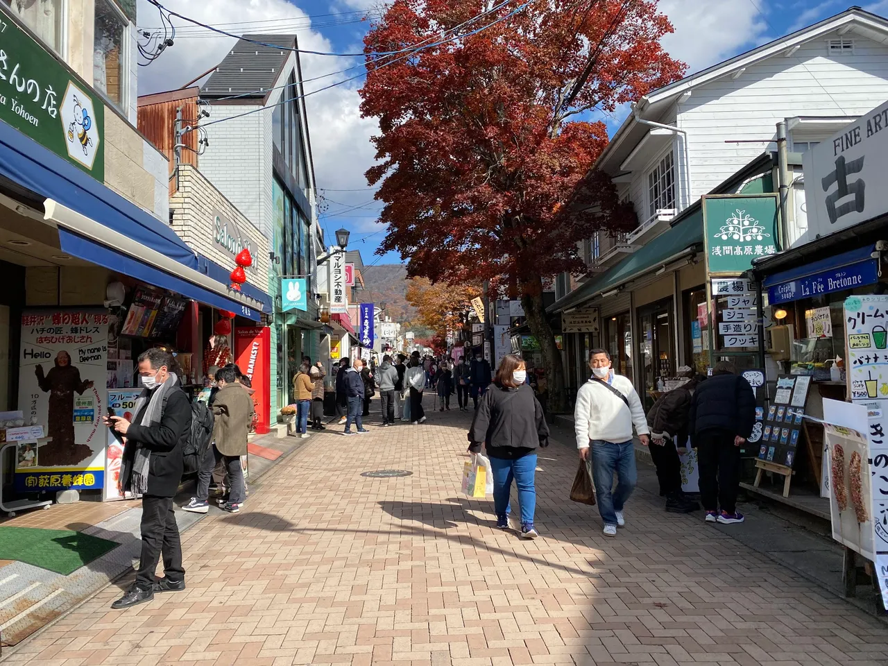 A cafe on the right and a honey store on the left