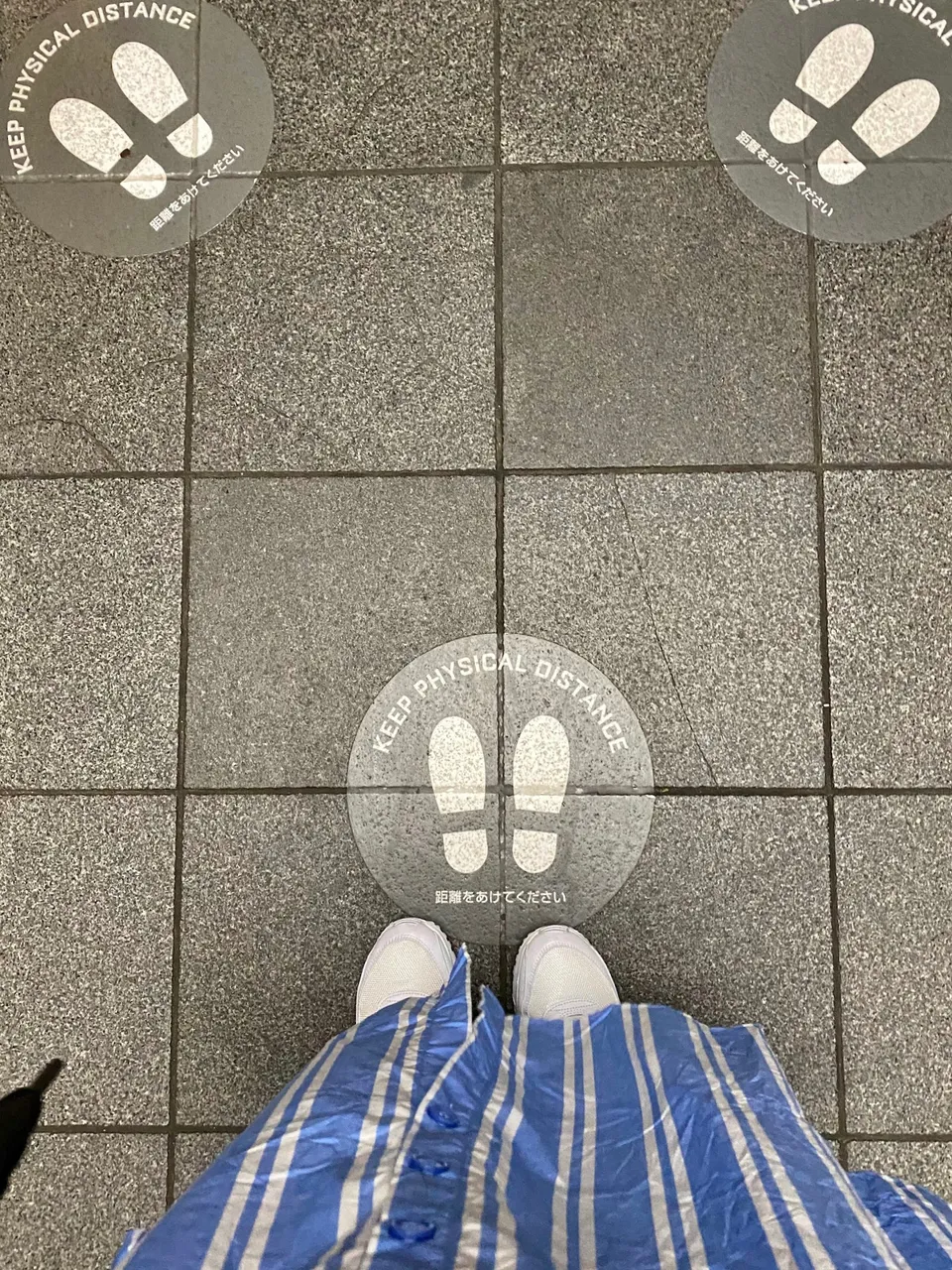 A reminder in the elevator to keep social distancing