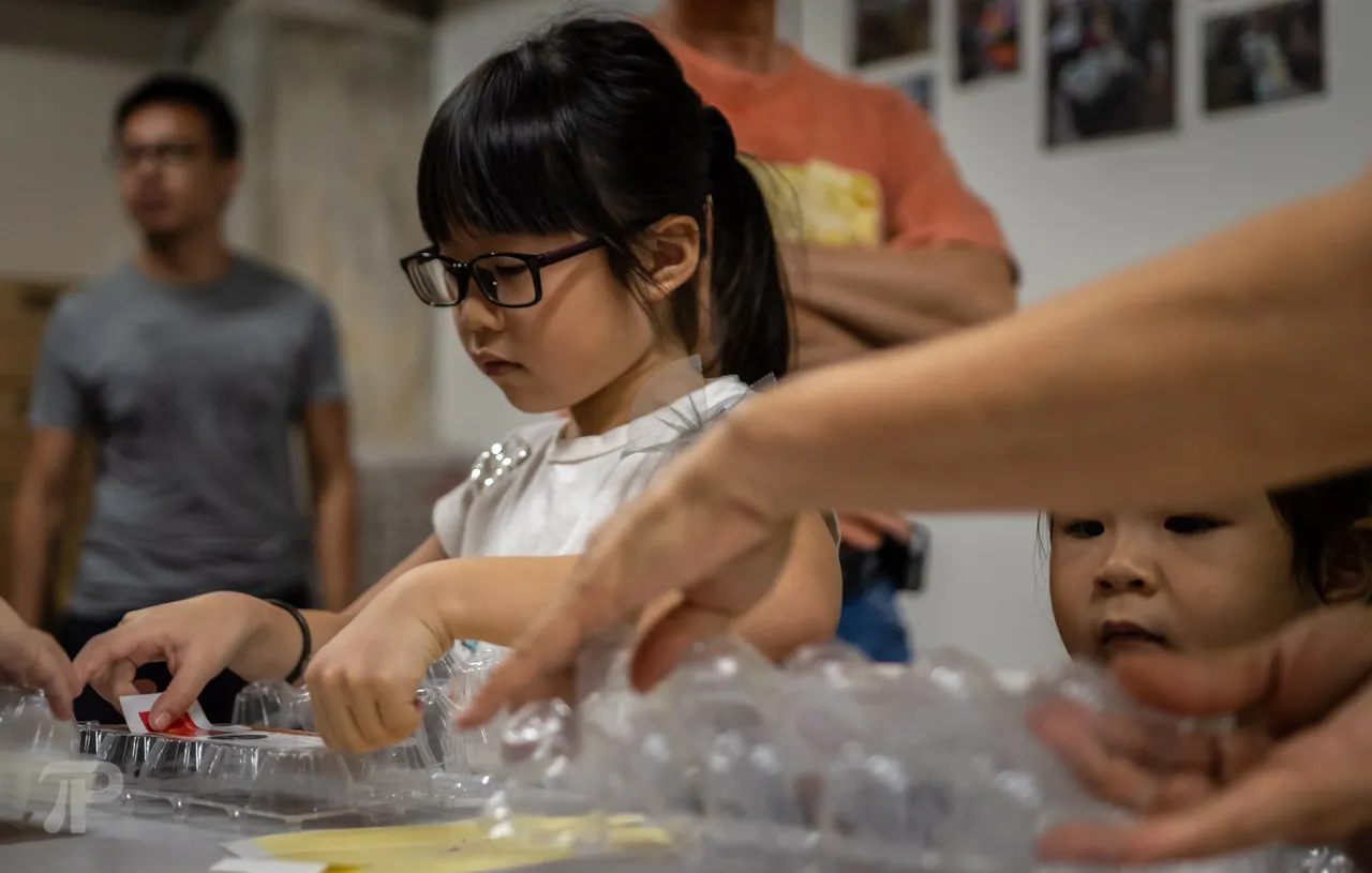 They were helping out as well, here with labelling the egg cartons