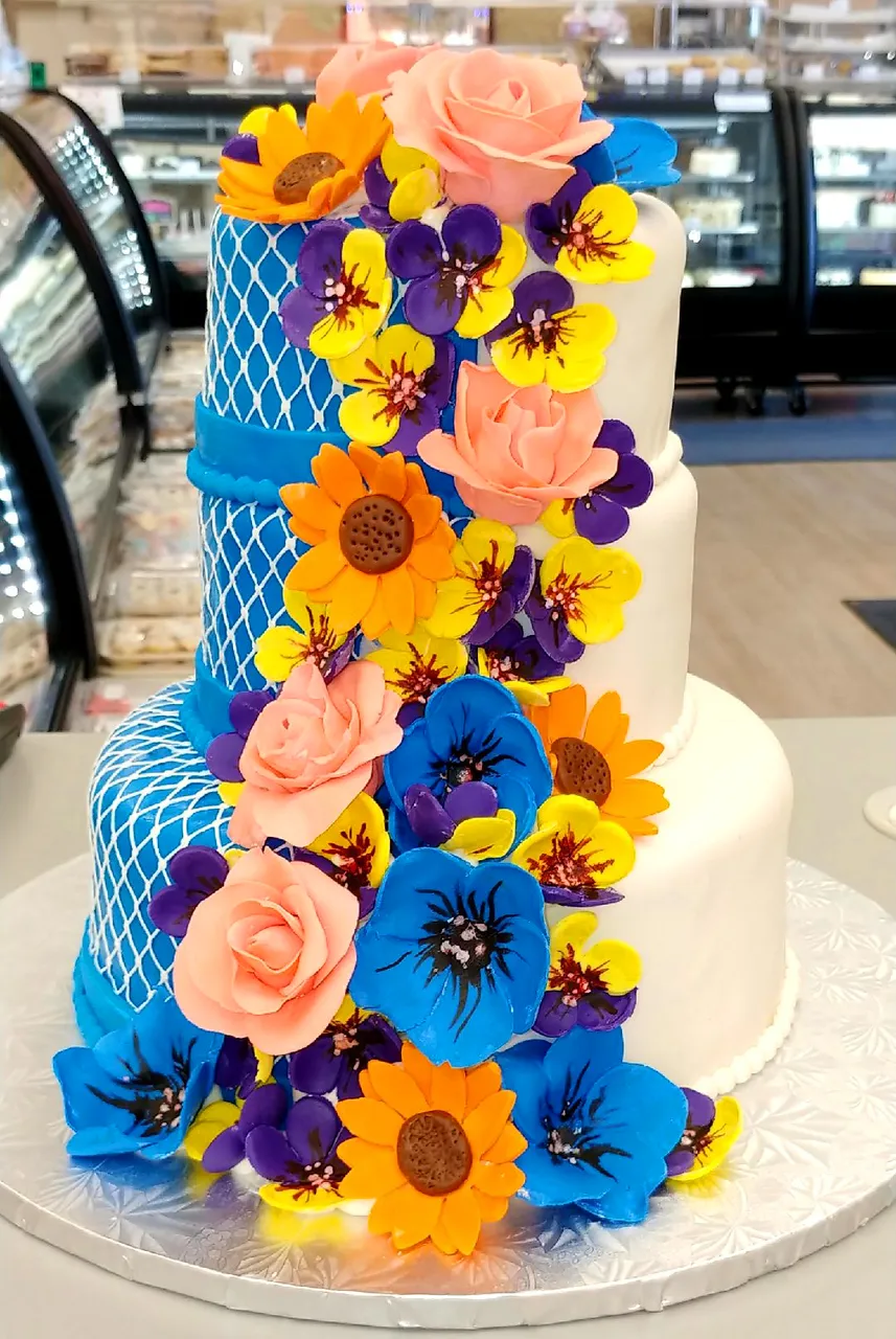 Three tier custom wedding cake finished in fondant by Goodies Bake Shop Winnipeg.jpg.jpeg