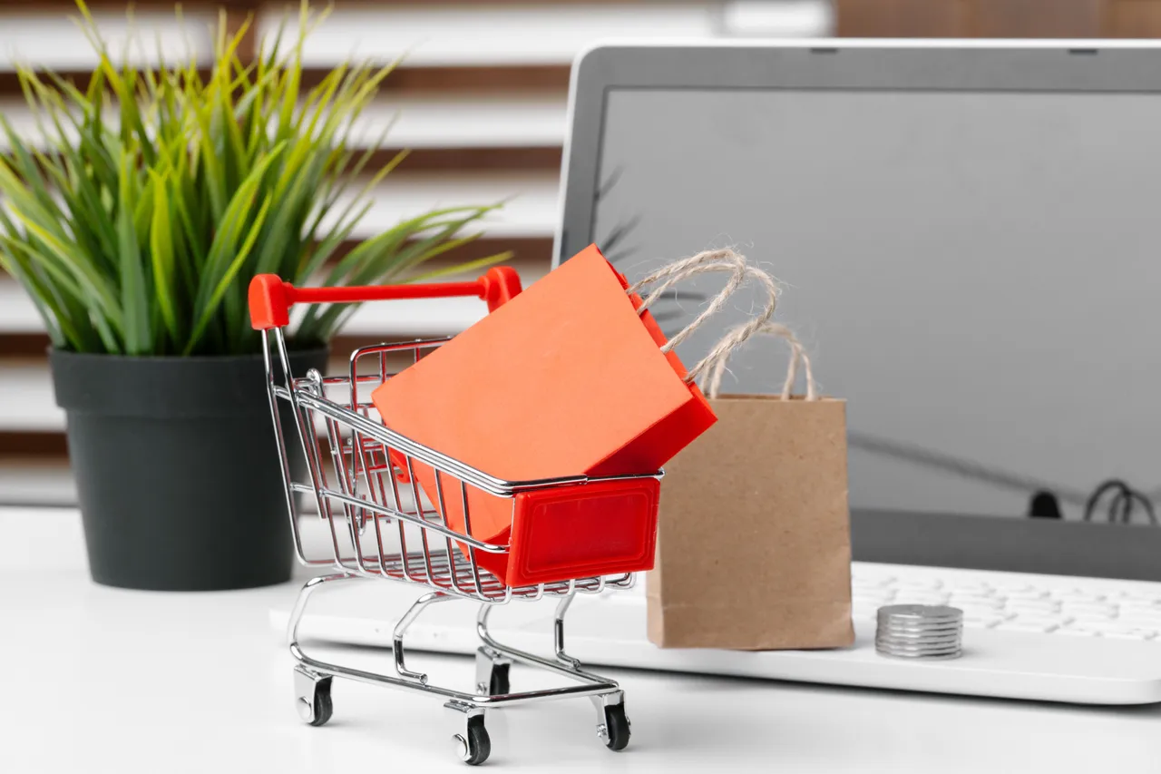 online-shopping-concept-shopping-cart-laptop-on-2023-11-27-05-04-36-utc-2.jpg