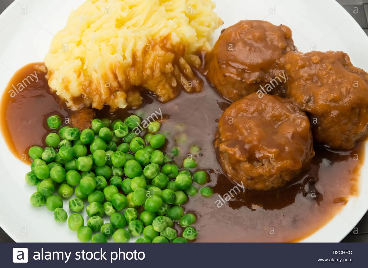 classic-british-dish-of-faggots-with-potato-mash-peas-and-gravy-a-D2CRRC.jpg