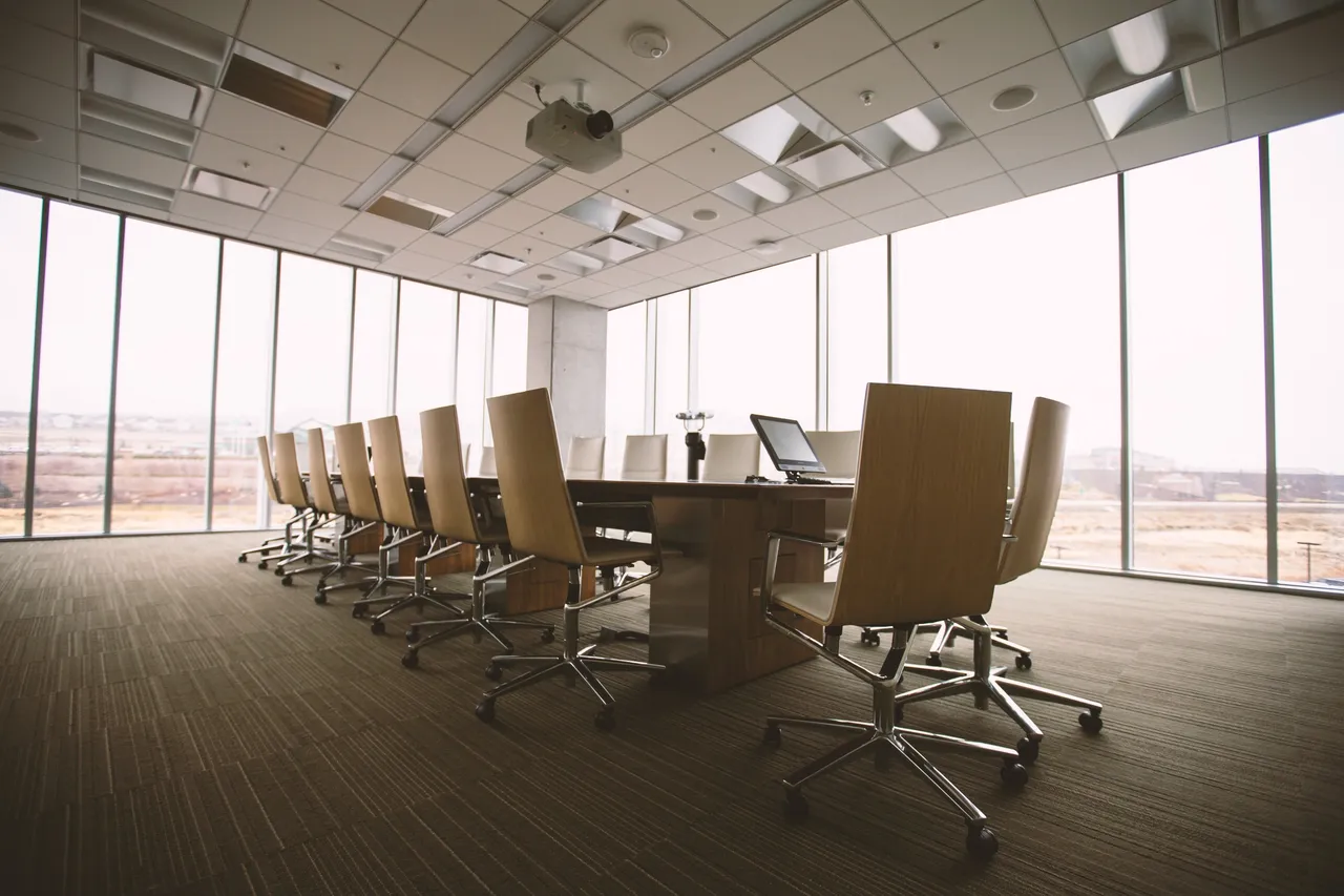 Canva  Empty Boardroom with a Long Table.jpg