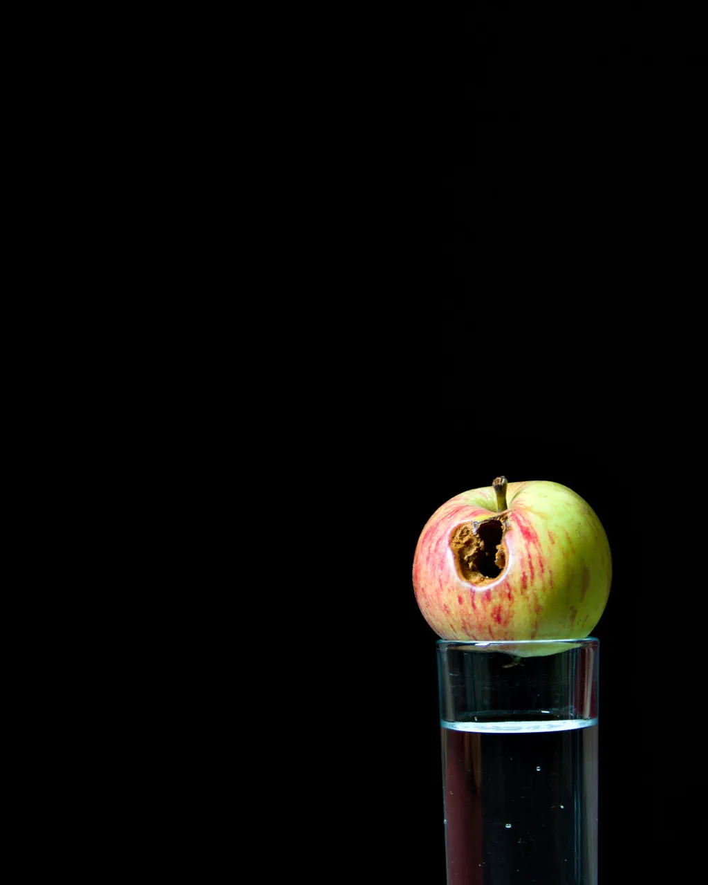 Apple on water glass
