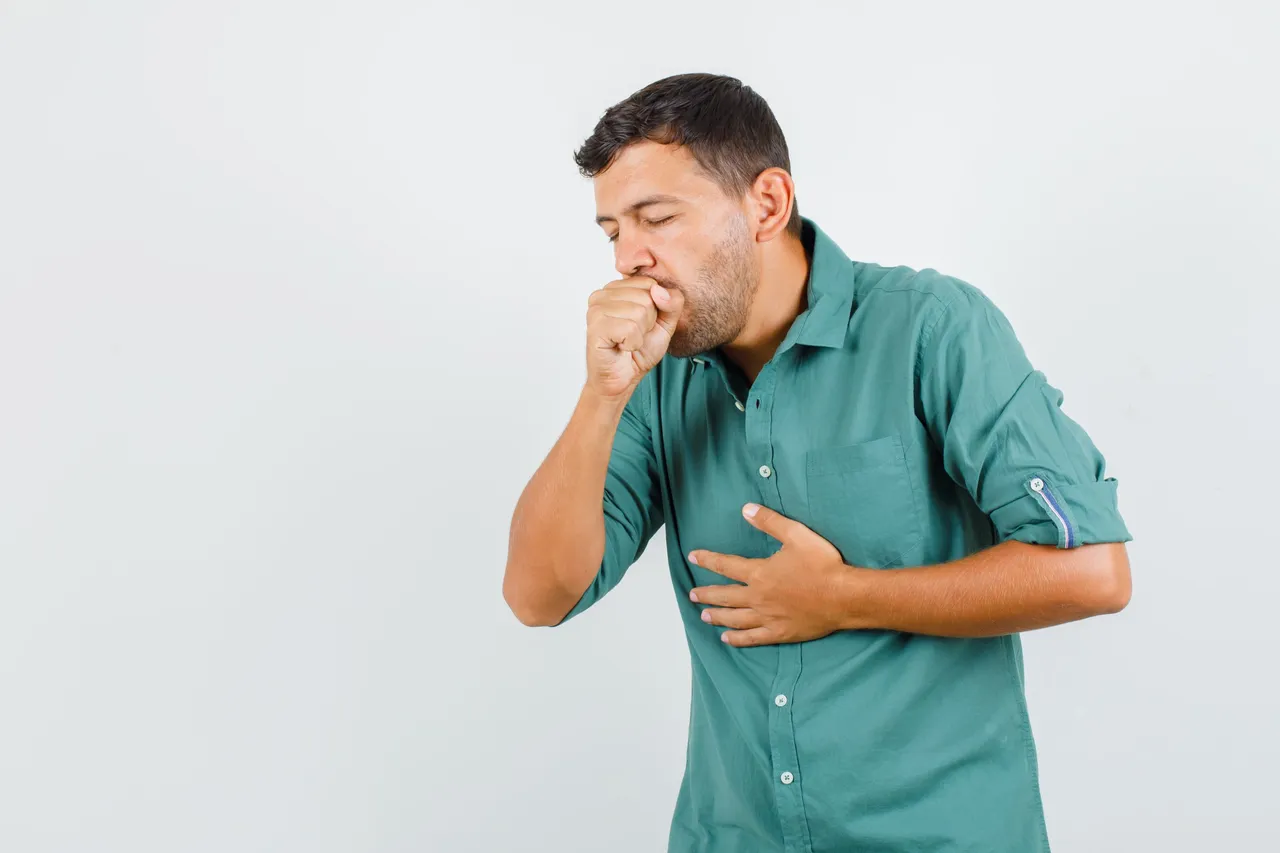 young-man-suffering-from-cough-in-shirt-and-looking-ill.jpg