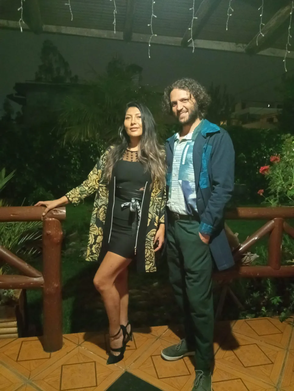 My cellphone is not good for taking pictures in the dark - but her brother did his best. We're both dressed in clothes made by the artisan factory they work at.