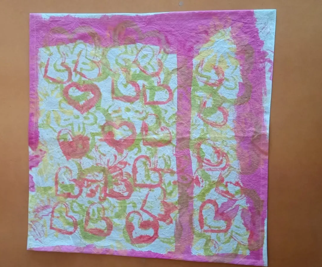 When I worked in the clothing factory, I organized a painting event for the local Special Olympics team, to raise funds for them. This one is my favorite, as the creator was so happy, she wanted to share her joy by printing as many hearts as possible on the sheet. That did feel special.