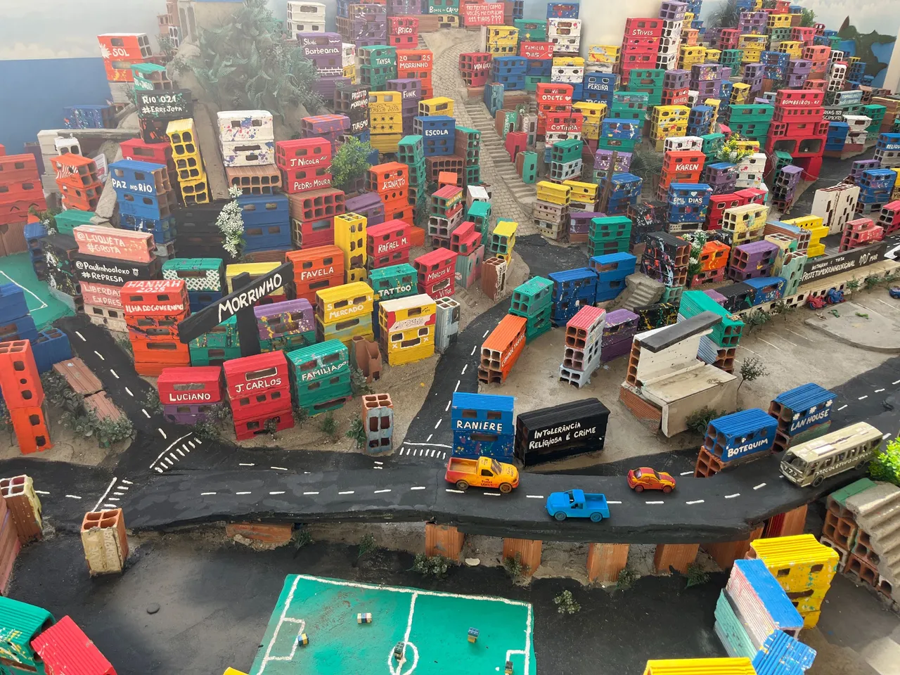 cement, bricks, toy cars, wire and wood