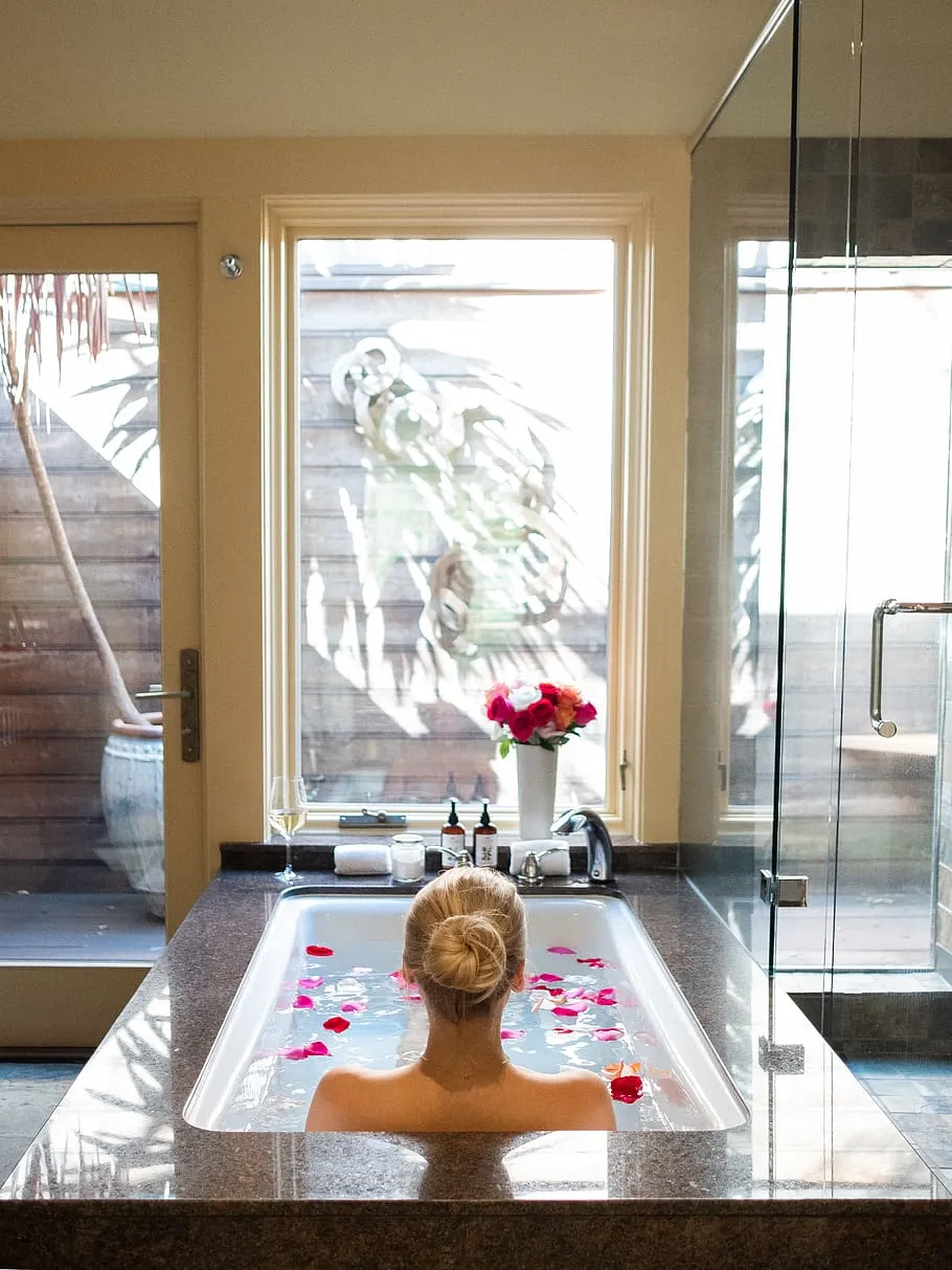woman-bathtub-spa-interior-relaxing-flowers.jpg