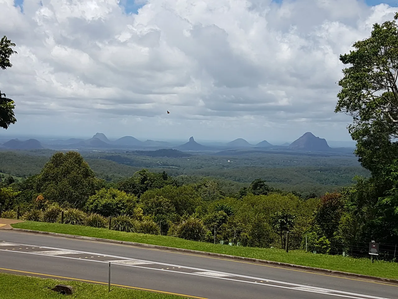 View of the Glasshouse Mountains from Mary Caincross Park. Mt Beerwah is the biggest one on the far right.
