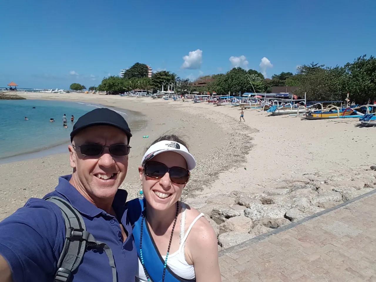 The beach at Sanur, SE of Denpasar (the capital of Bali). Denpasar translates to mean ”the market”.