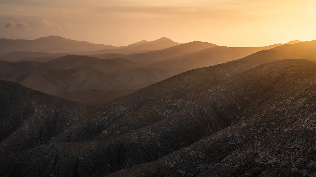 Endless rolling hills in golden light