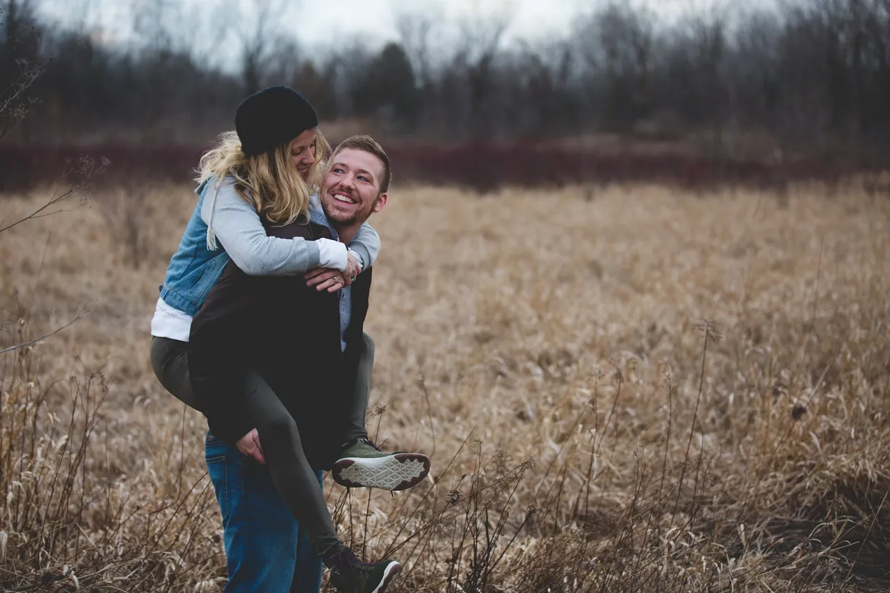 photo of a married couple in a field
