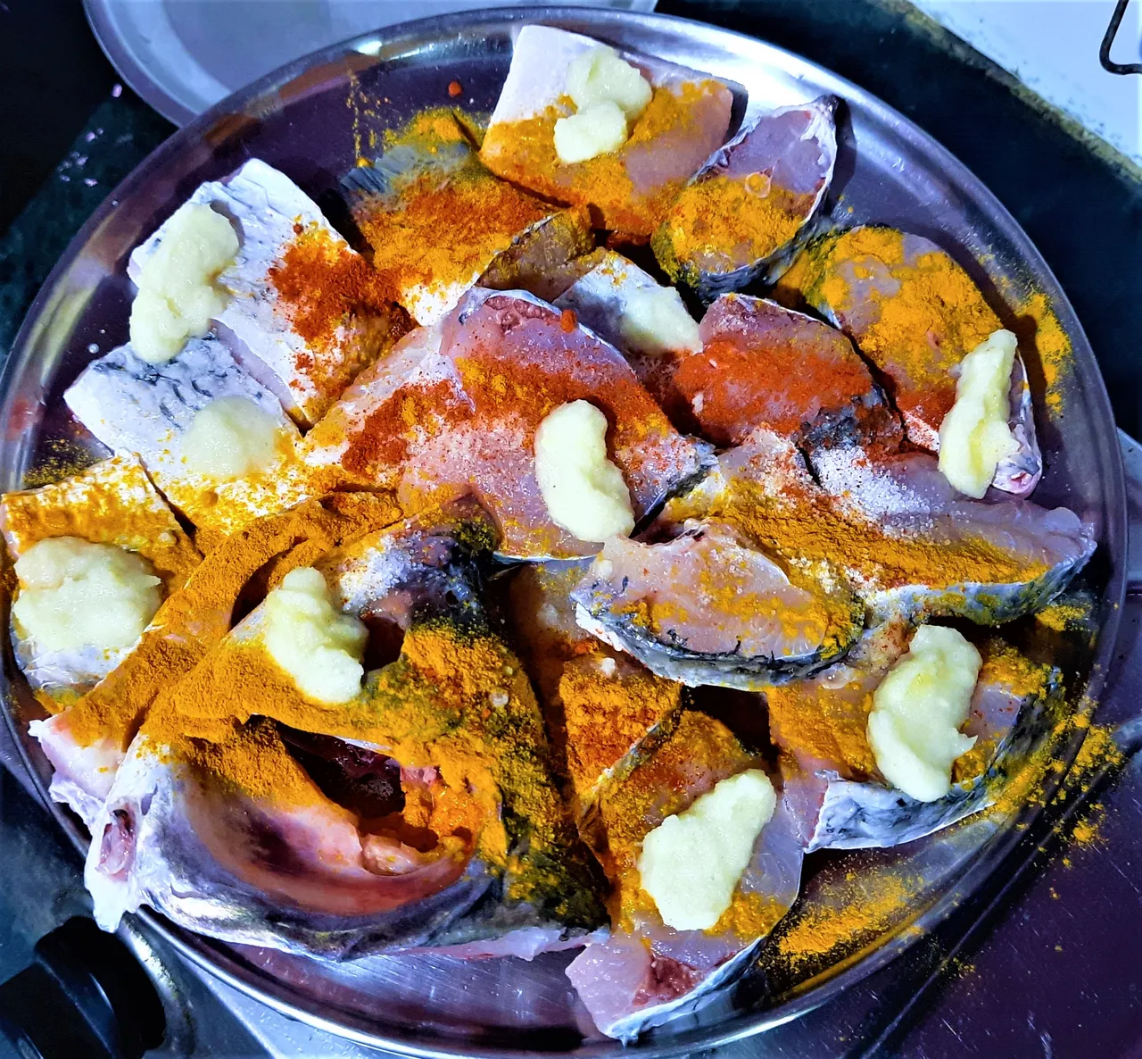 raw_fish_mixing_with_turmaric_powder_and_garlic_paste.jpg