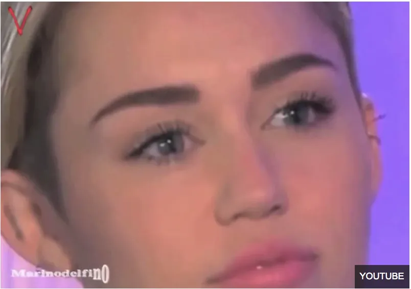 Miley Cyrus Blinks sideways---Cloning Reptile.png