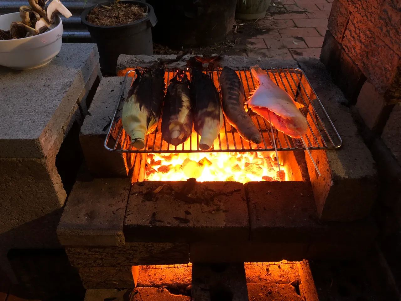 Sweet corn, sweet potatoe and fish on BBQ