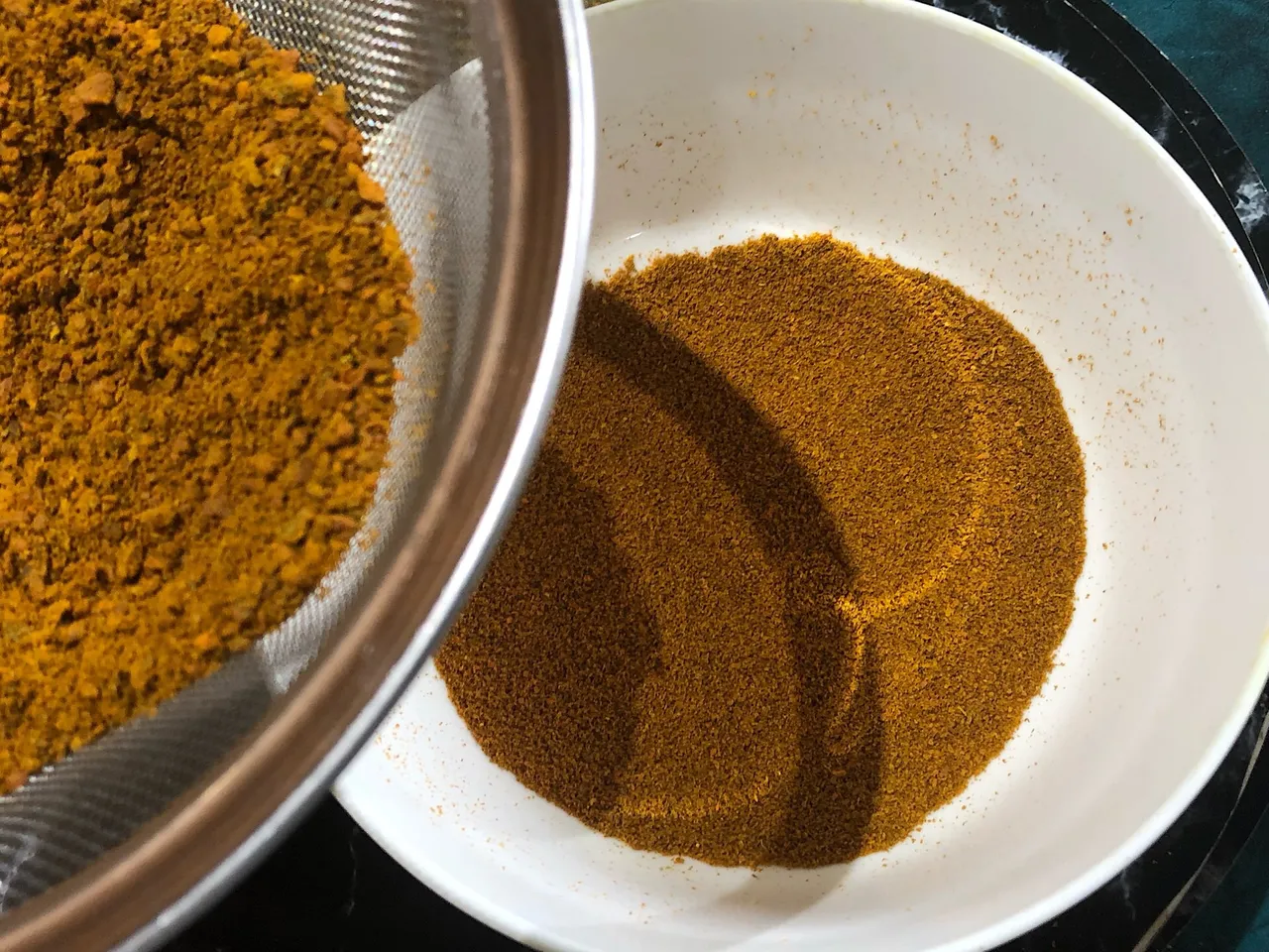 Sifting Turmeric Powder