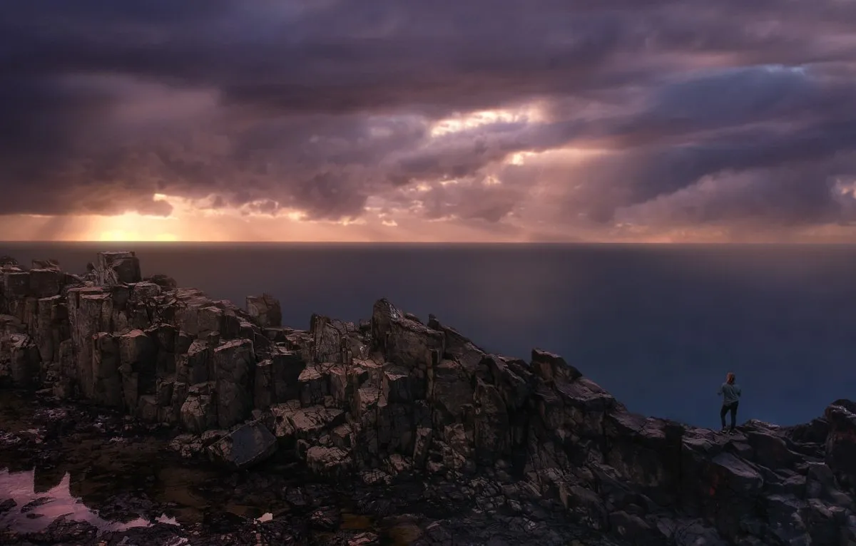 Standing tall on the rock pillars of Bombo Quarry at Sunrise