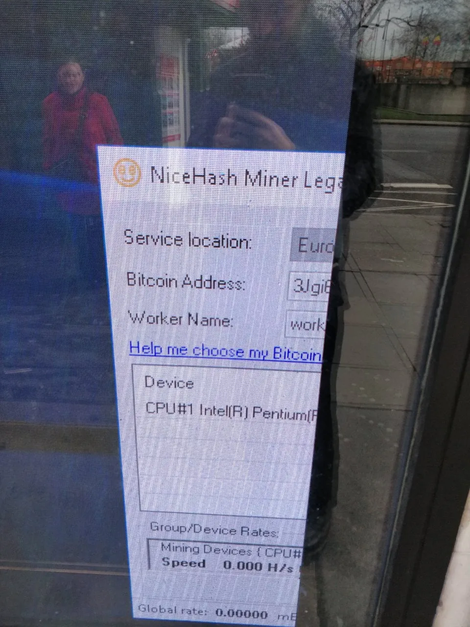 Close up of the window. It is a BitCoin miner