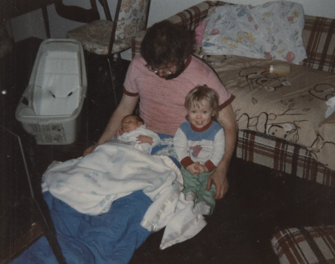 1982 Sleeping Don Holding Baby Rick Smiling Katie Couch.png
