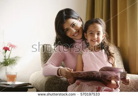 stock-photo-little-girl-sits-on-mother-s-lap-both-smile-at-camera-570197533.jpg