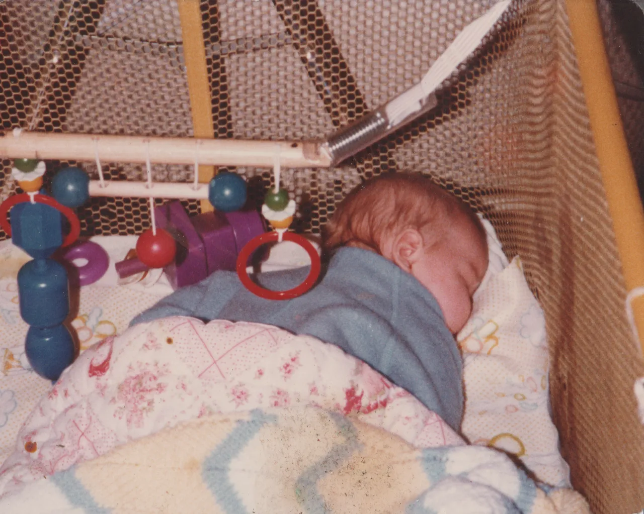 1980-12 Katie Sleep Crib.png