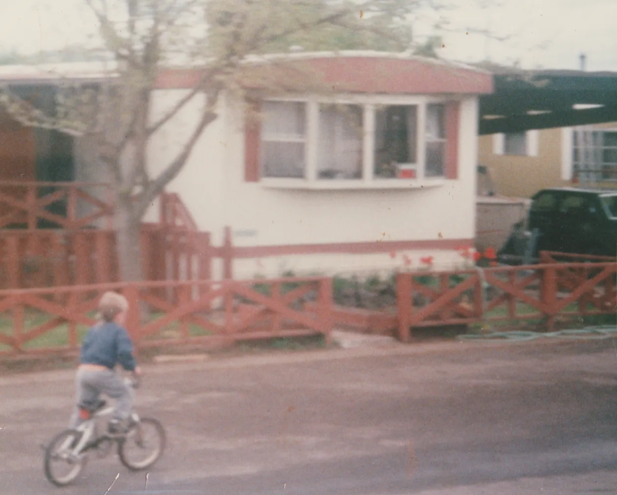 1991 - Kyle on a bike in front of 163 on the road or maybe not Kyle, not sure which year.png