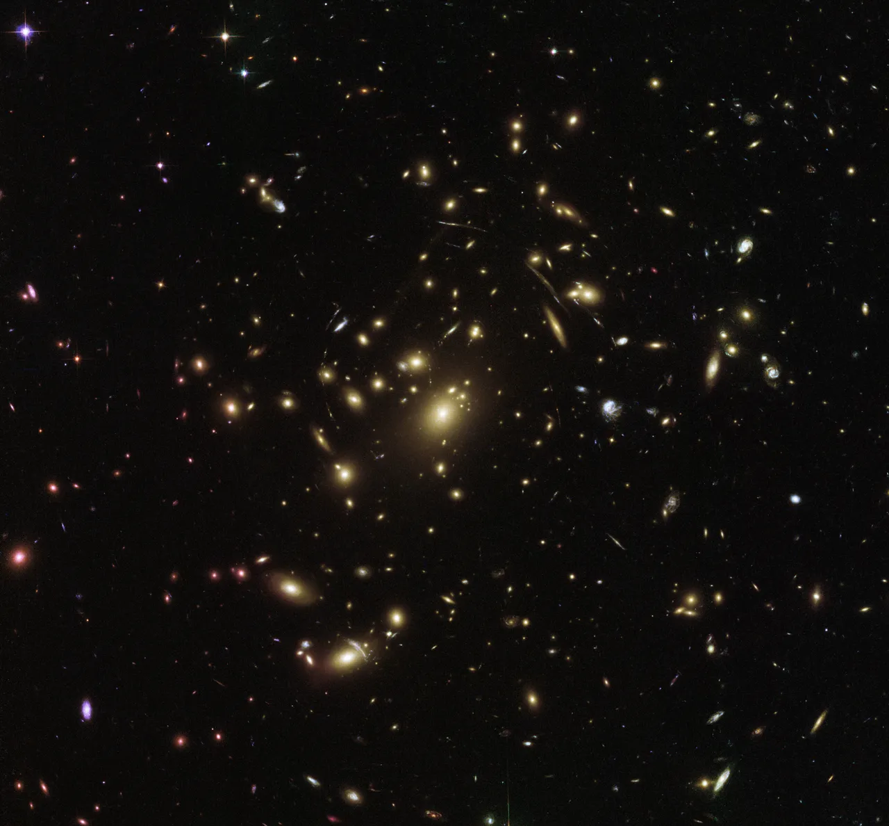 The Hubble Space Telescope peers into the distant universe to reveal a galaxy cluster called Abell 2537.