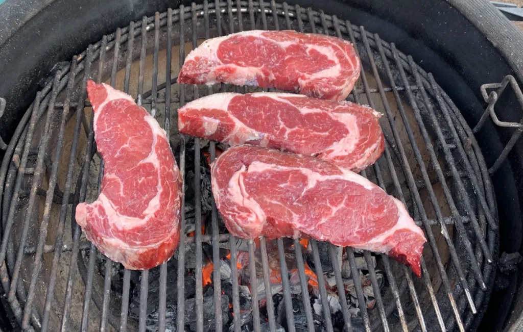 Rib Steaks on a charcoal grill