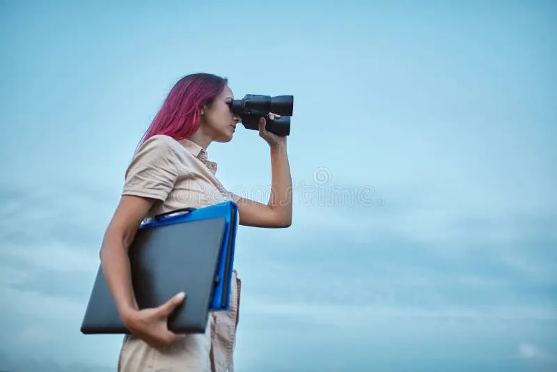 Woman looking forward in binoculars. Lady holding laptop and folder. Goal setting and new horizons concept, copy space.  royalty free stock images